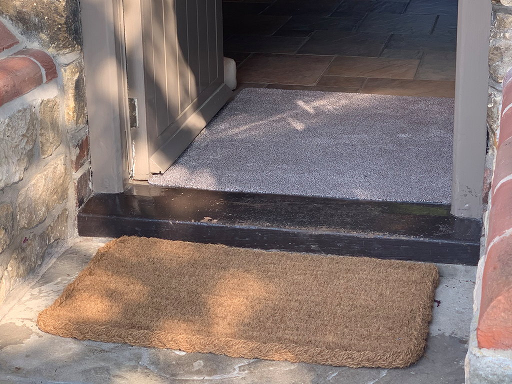 Combat dirt brought in by foot traffic with and indoor doormat teamed with an outdoor doormat